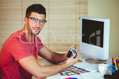 Handsome hipster working at desk