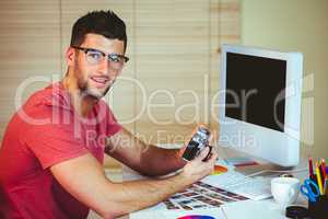 Handsome hipster working at desk