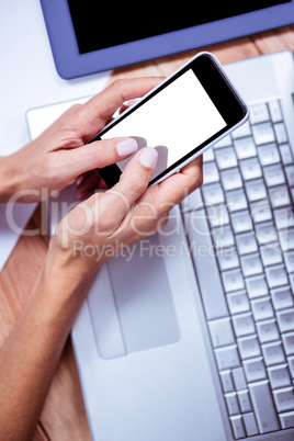 Feminine hands using smartphone