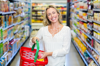 Woman buying food and smiling at the camera