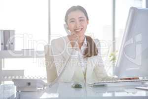 Smiling businesswoman using her telephone