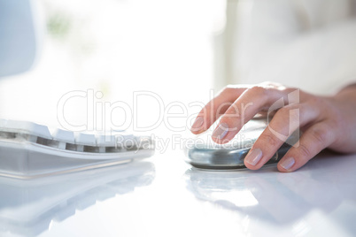 Close up of a woman using a mouse