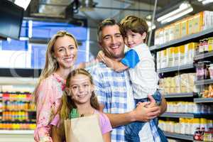 Happy family at the supermarket