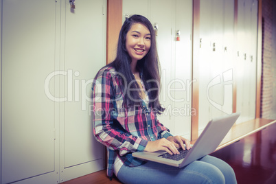 Smiling student sitting at the computer