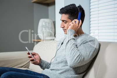 happy casual man listening music