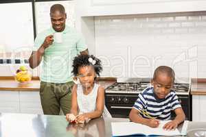 Father and children in the kitchen
