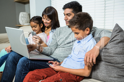 Family sitting on the sofa