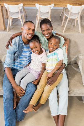 Happy family relaxing on the couch