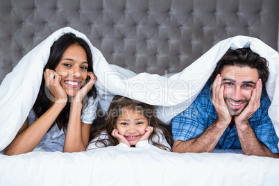 Happy family posing for camera