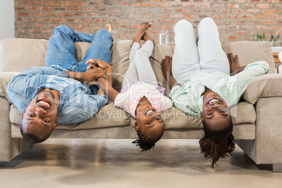 Happy family relaxing on the couch