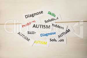 Autism words on wooden table