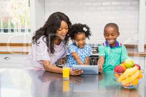 Mother and children using tablet