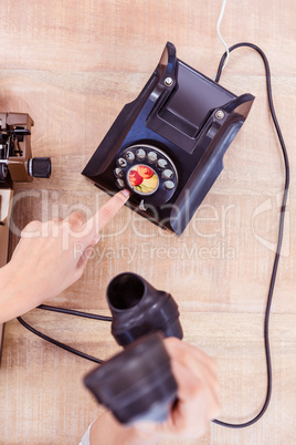 Above view of typewriter and old phone