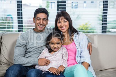 Smiling family on the sofa