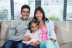 Smiling family on the sofa