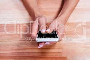 part of hands typing on smartphone