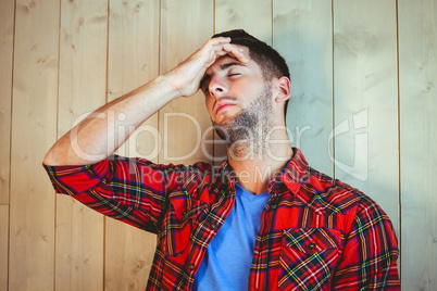 Handsome hipster feeling stressed out