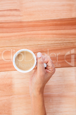 Woman hands holding cup of coffee