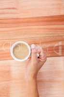 Woman hands holding cup of coffee