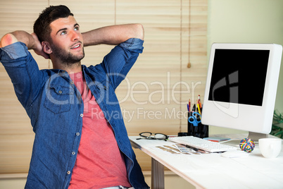 Handsome hipster working at desk