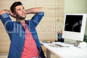 Handsome hipster working at desk