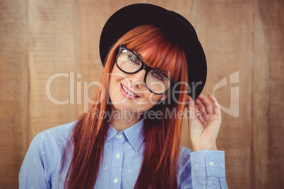 Smiling hipster woman posing face to the camera
