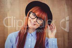 Smiling hipster woman posing face to the camera
