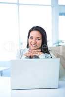 Smiling businesswoman at the desk