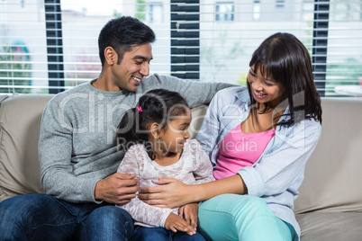 Smiling family on the sofa