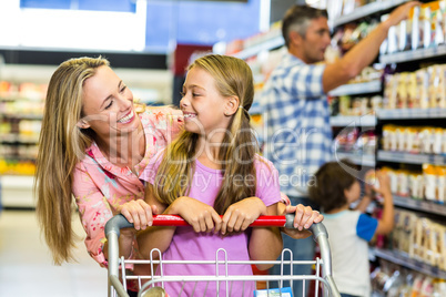 Smiling mother and daughter