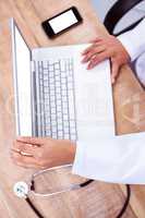 Doctor using laptop