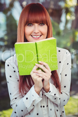 Attractive hipster woman holding a book Attractive hipster woman holding a book