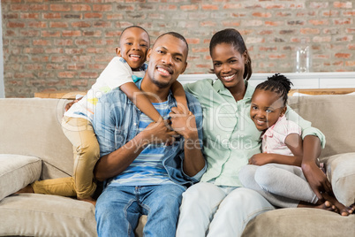 Happy family relaxing on the couch