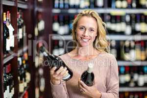 Woman holding bottles of wine