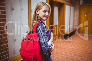 Pretty student with backpack looking at the camera