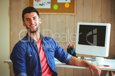 Handsome hipster working at desk