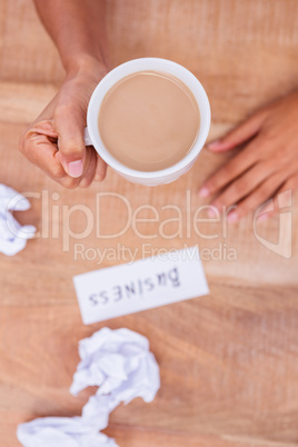 Above view of paper ball and coffee