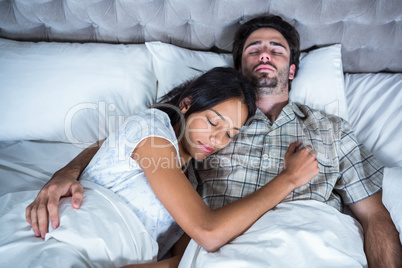 Couple sleeping together