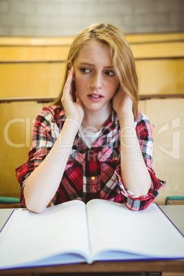 Worried student studying on notebook