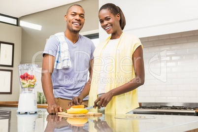 Young casual couple making fruits