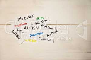 Autism words on wooden table