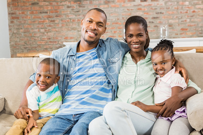 Happy family relaxing on the couch