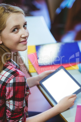 Blonde student using tablet during class