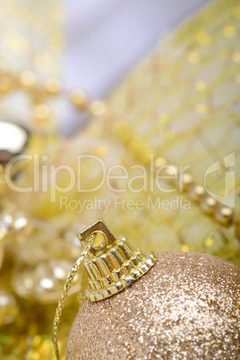 festive golden christmas decoration and white balls, close up