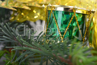 Christmas background with drums, green eve tree branch, golden new year decoration