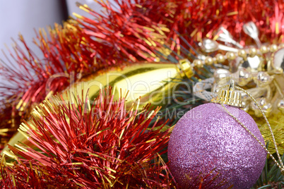 Closeup of Christmas balls and green fir tree branch, new year invitation card