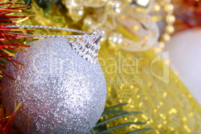 Closeup of Christmas balls and green fir tree branch, new year invitation card