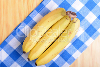 Bunch of bananas on white bowl, health food concept