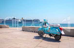 Blue scooter on the waterfront