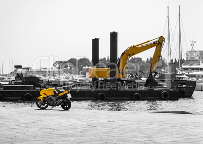Motorcycle with an excavator in black and yellow